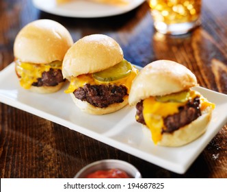 Three Mini Burger Sliders In A Row