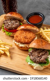 Three Mini Burgers With Chicken And Meat Served With French Fries