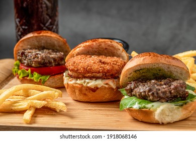 Three Mini Burgers With Chicken And Meat Served With French Fries