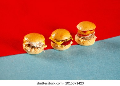 Three Mini Burgers Sliders In Beef And Chicken With Cheese Perfect For A Party