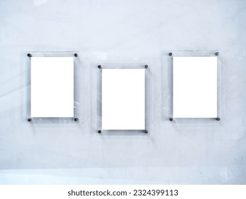 Three mockups of white blank paper poster or photo frames, acrylic materials, vertical style hanging on white dirty wall background. - Shutterstock ID 2324399113