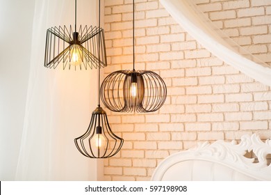 three modern black lamps hanging - Powered by Shutterstock