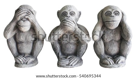 Three monkey isolated on white background,close up of hand small statues with the concept of see no evil, hear no evil and speak no evil.