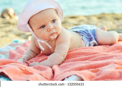 Three Months Old Baby On The Beach