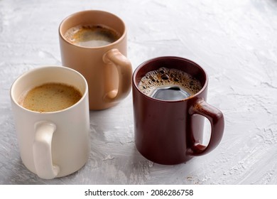 three mugs of coffee on the table with copyscape. High quality photo
