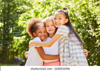 Three multicultural girls hugging each other as best friends - Powered by Shutterstock