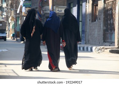 Three Muslim Woman Walking On The Street