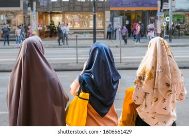 Three Muslim Women Or Girls Wearing Hardscarf / Hijab From Behind