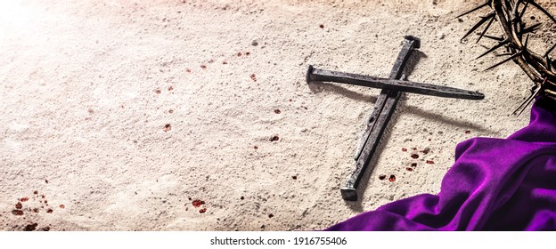 Three Nails In Shape Of Cross With Purple Robe, Crown Of Thorns And Blood Drops On Dirt Floor - Crucifixion Of Jesus Christ