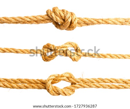 three nautical knots made of rough natural rope isolated on white background