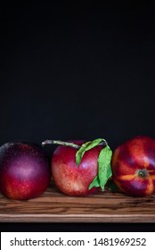 Three Nectarines On A Cutting Board With A Dark Background, Fresh Farmers Market Produce On A Wooden Surface, Copyspace, Copy Space, Mockup, Graphic Design