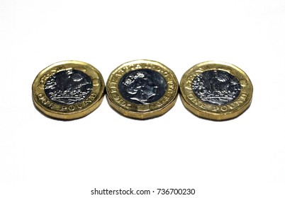 Three New One Pound Coins Isolated On White.