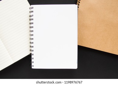 Three notes with white and craft papers on a black background. Copyspace.