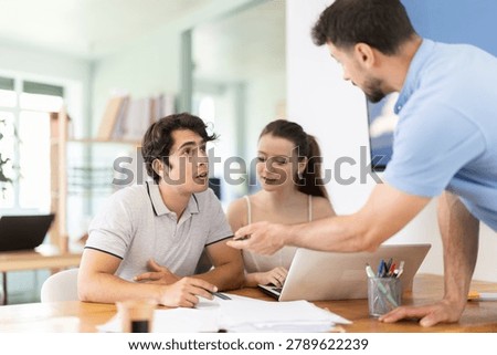Three office employees read and process documents. Familiarization with contract, business correspondence, letter of claim, employment contract