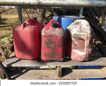 Three Old Dirty Gas Jugs