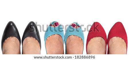 Three pairs of female legs on a white background. View from the top.