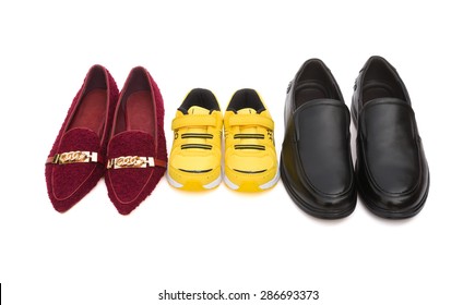 three pairs of shoes for dad mom and son on white with clipping path, family concept