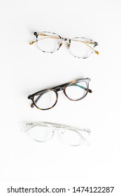 Three Pairs Of Tortoise Shell Glasses On White Background, Isolated Glasses