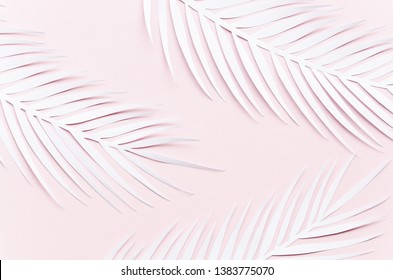 Three Paper Palm Leaves On Pink Table