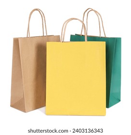 Three paper shopping bags on white background - Powered by Shutterstock