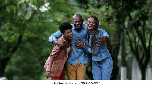 Three People Celebrating Success Uniting Group. African Ethnicity