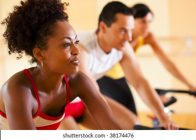 Three people in the gym - Powered by Shutterstock