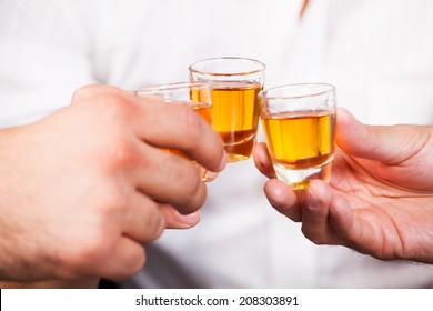 three people with rum shots