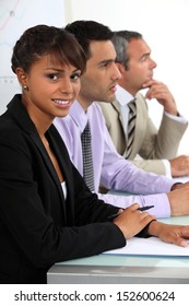 Three People Sat On Interview Panel