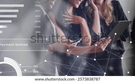 Three people smiling, using digital devices, discussing data. Business teamwork, technology, collaboration. Diverse group, technology focus, teamwork in action. Diverse business people in team meeting