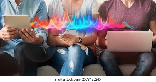 Three people using digital devices with colorful sound waves. Technology, digital, devices, and sound waves are central to this image. People connected to internet and social media. - Powered by Shutterstock - Get 15% off with code: PIKWIZARD15