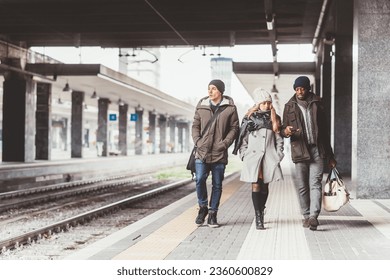three people young multiethnic friends walking  - Shutterstock ID 2360600829