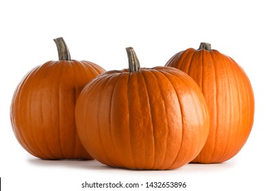 Three perfect orange pumpkins isolated on white background , Halloween concept