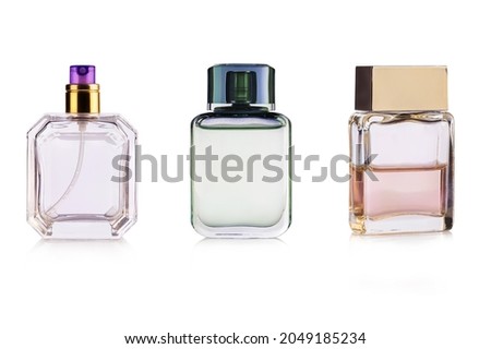 Three perfume bottles isolated on white background.