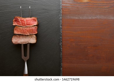 Three Pieces Of Meat On A Fork For Meat. Three Types Of Meat Roasting, Rare, Medium,well Done. 