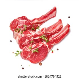 Three pieces of mutton meat with herbs and mixed peppers isolated on white background. Top view of mutton steaks with thyme herb. - Powered by Shutterstock