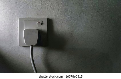 Three pin plug in the supply socket, switch on with side lighting. 