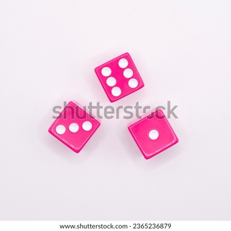 three pink dice on a white background
