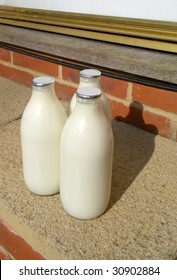 Three Pints Of Milk On A Doorstep.