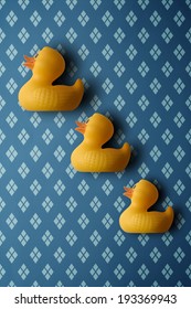 Three Plastic Ducks Mounted On A Wall. A Different Take On The Traditional Ceramic Flying Ducks That Adorn The Walls Of Some Homes.