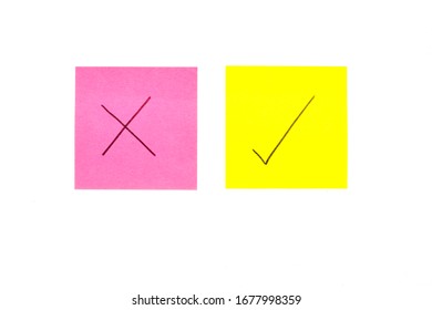 Three post its on white background with a question mark and tick on it