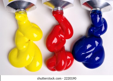 Three Primary Colors Comming Out Of Tubes