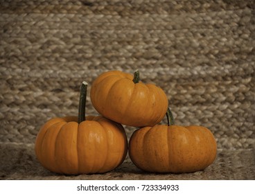 Three pumpkins stacked in a triangle