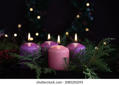 Three purple and one pink advent candles in Christmas eve, catholic symbol.