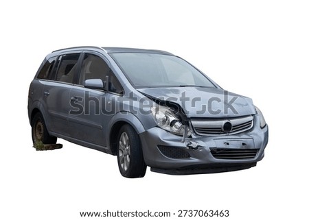 Three quarter front view of a wrecked silver car with significant front-end damage, crashed vehicle isolated on white background