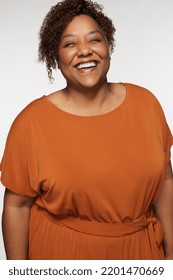 Three Quarter Length Shot Of Beautiful African American Woman In Her Late 30s Smiling And Posing On White Background