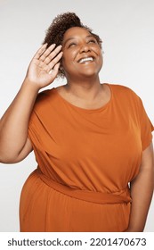 Three Quarter Length Shot Of Beautiful African American Woman In Her Late 30s Smiling And Posing On White Background