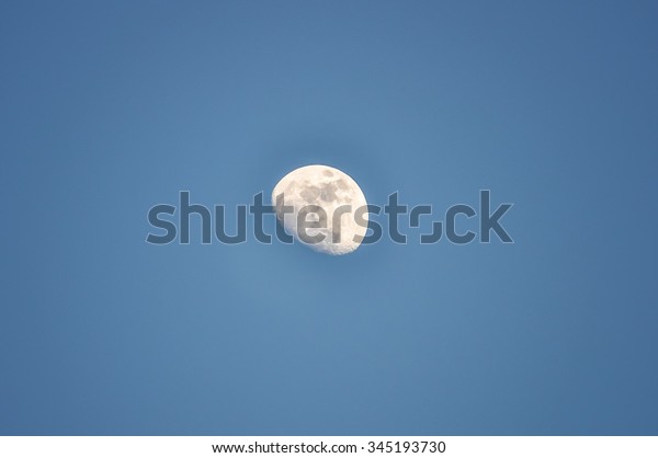 Three quarters moon in\
daylight
