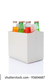 Three Quarters View Of A Six Pack Of Assorted Soda Bottles Over A White Background With Reflection.