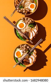 Three Ramen Bowl On An Orange Background