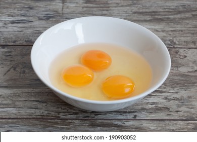 Three Raw Egg Yolk On The Plate